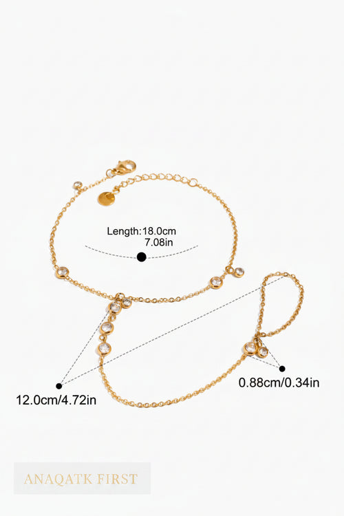 Gold bracelet with measurements on a white background