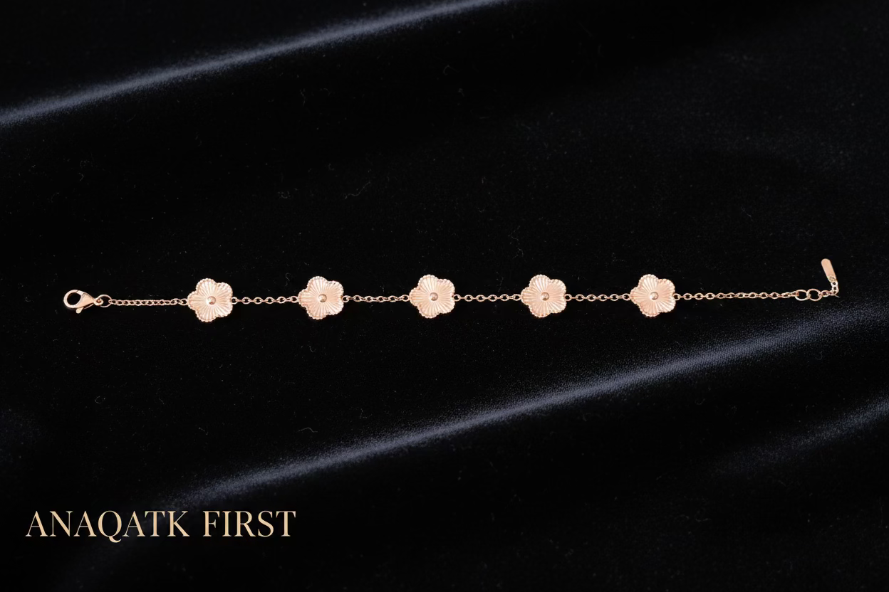 Bracelet with floral designs on a dark background, featuring the brand 'ANAQATK FIRST'.