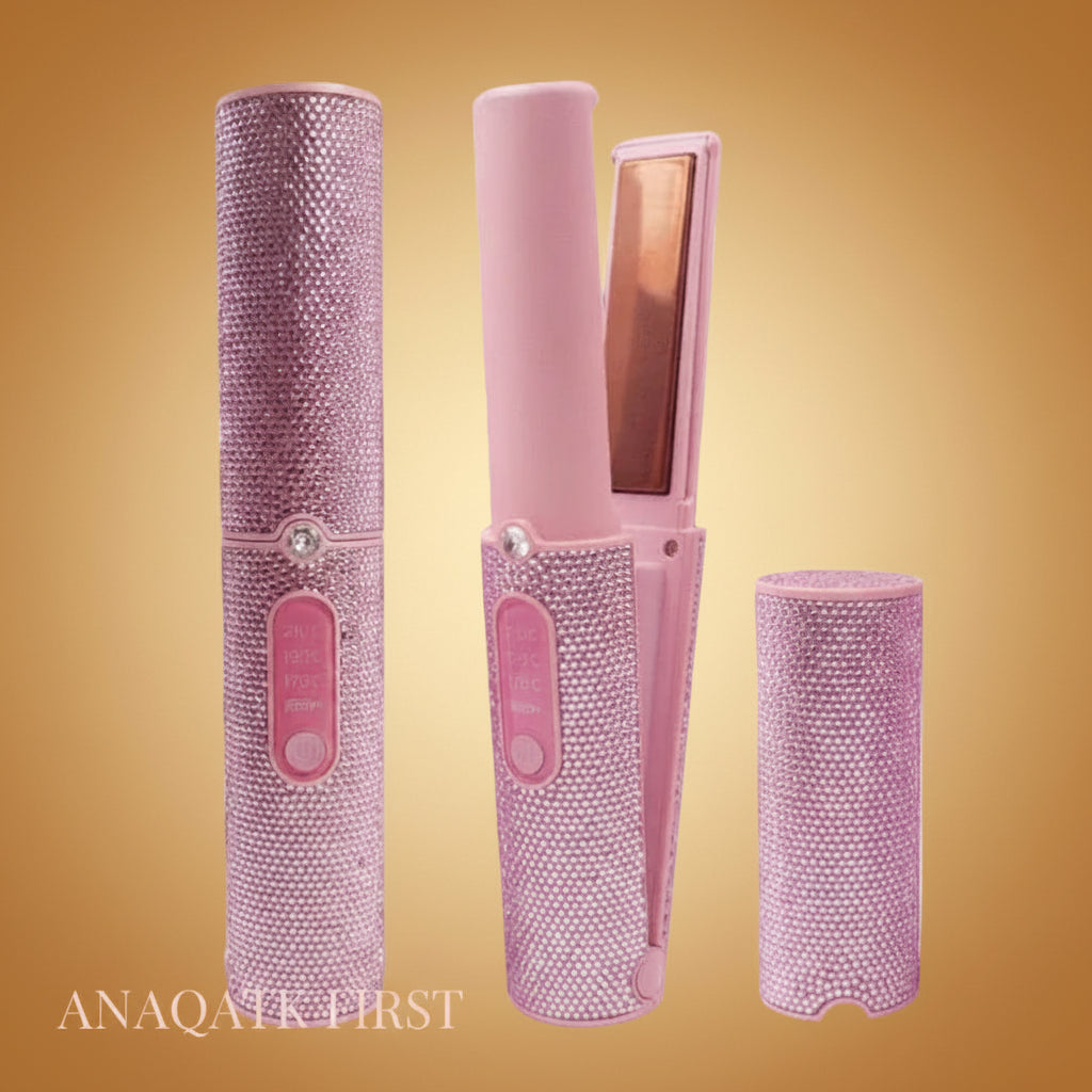 Pink hijab straightener with rhinestone accents on a black background, featuring the brand 'ANAAK FIRST'.
