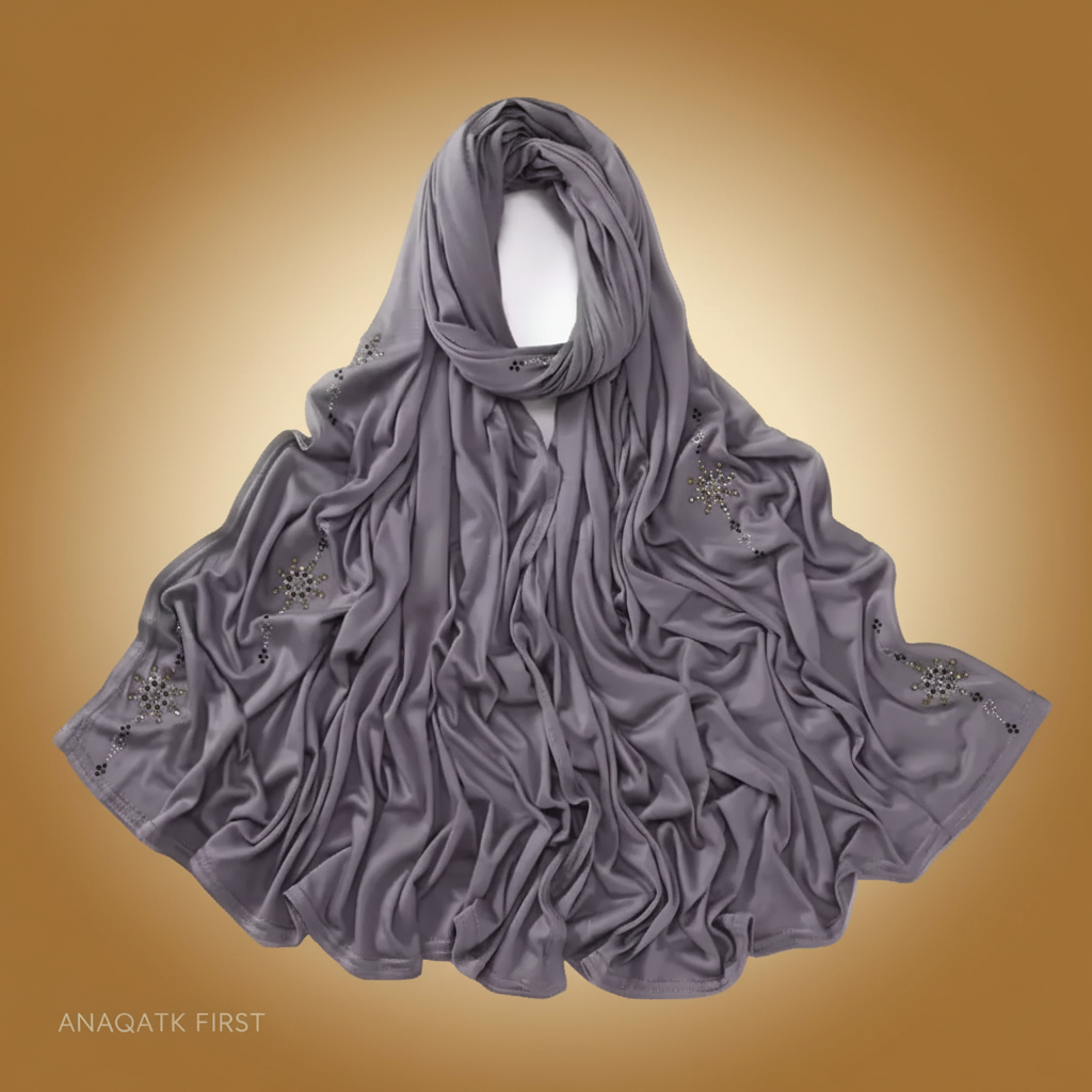 Gray scarf with floral embellishments on a white background