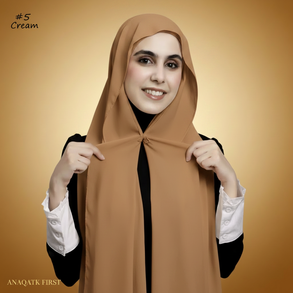 Woman wearing a cream hijab with a white background
