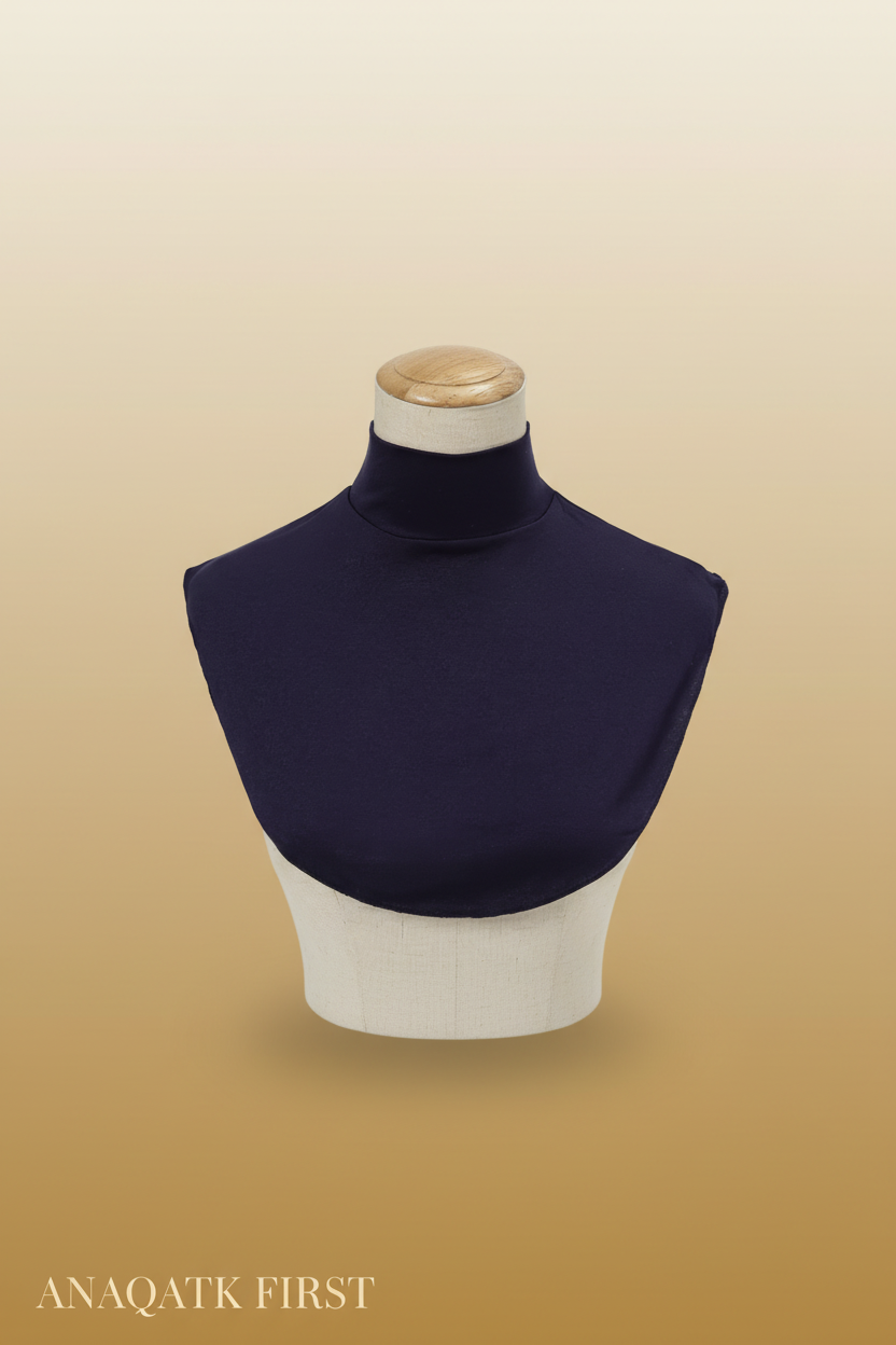 Navy blue turtleneck on a mannequin with a plain background