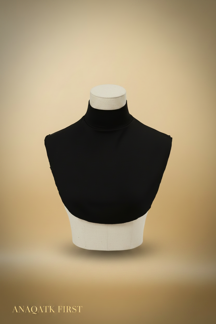 Black turtleneck on a mannequin bust against a white background