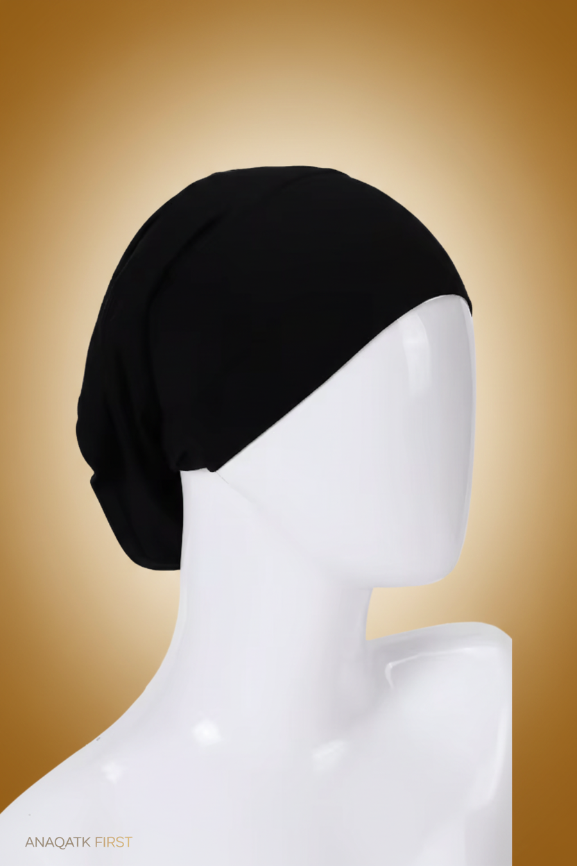Black headscarf on a mannequin head against a white background