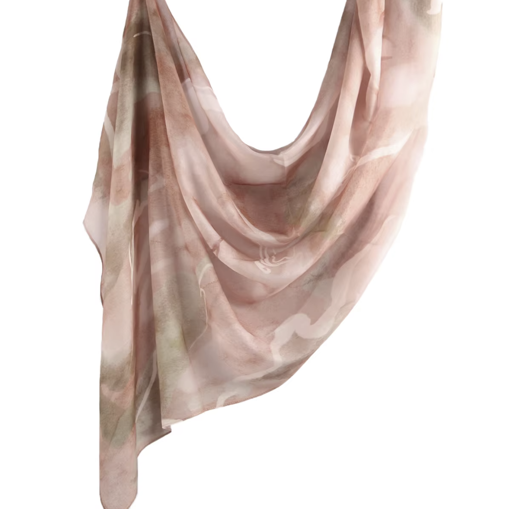 Pink and beige patterned scarf on a white background