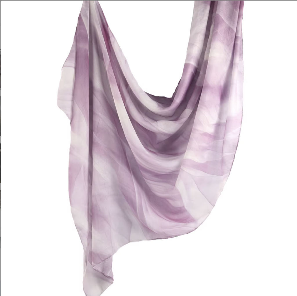 Purple and white scarf draped over a white background